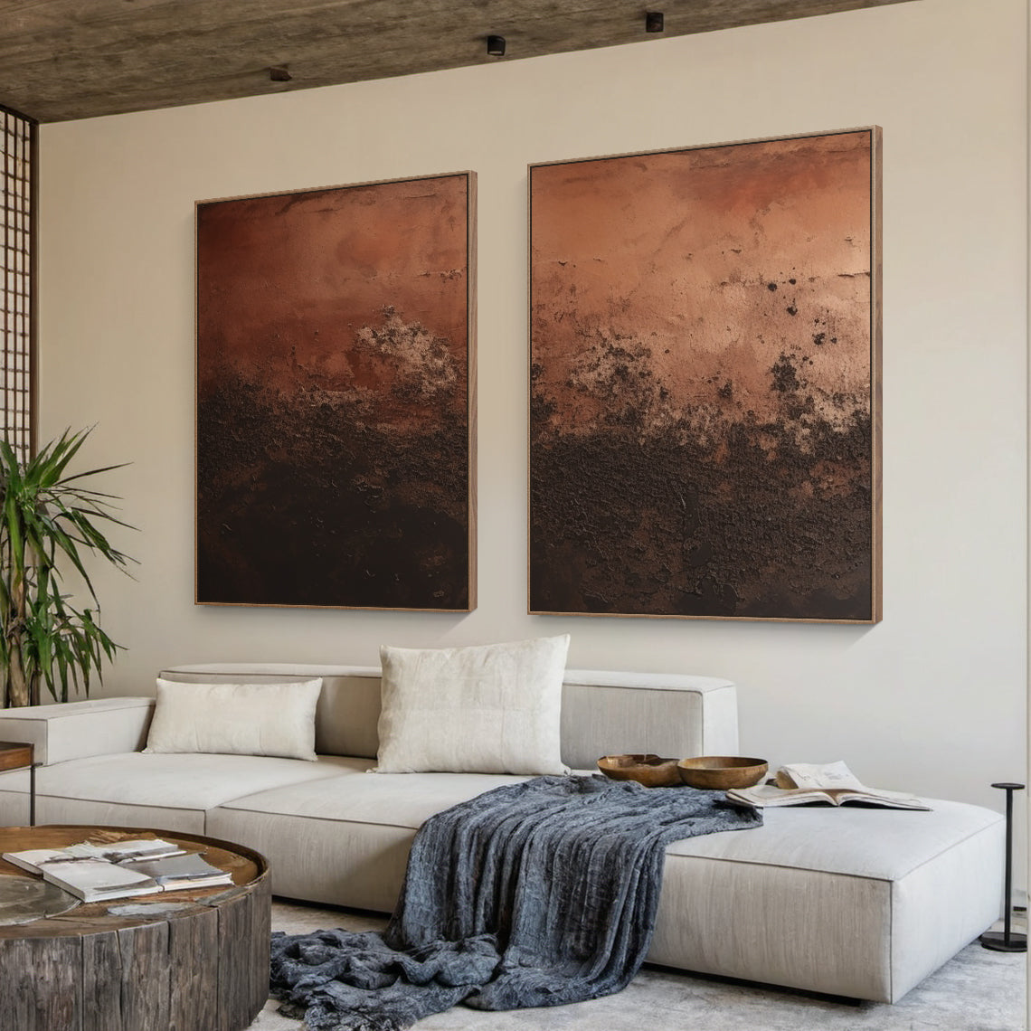 Abstract Red Brown Wall Art Set of Two (AURA213) - Warm red-brown to deep chocolate brown gradients, heavy impasto knife-stroke texture, modern organic general abstract style. Perfect for Japandi dining room decor, minimalist living room focal point, or modern organic interiors. Hung above a light oak dining table in a sunlit Japandi dining room, paired with neutral-toned linen chairs, infusing warm earthy hues and a tranquil artistic centerpiece that complements the space’s balanced, natural and uncluttere