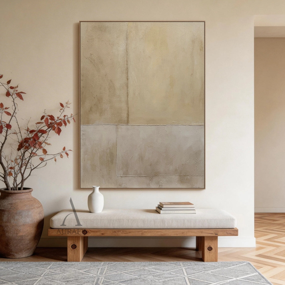 Square beige abstract wabi-sabi canvas wall art mounted on an off-white living room wall above a low linen sofa, divided into 4 irregular rectangular blocks with layered neutral beige hues: upper sections in warm cream beige and light khaki, lower sections in cool muted grayish off-white. Full surface has micro cement/mineral plaster-like uneven textured finish with subtle mottled effect, rough raised raw-edge seams separate each block, this soft organic tactile Japandi minimalist neutral wall decor brings