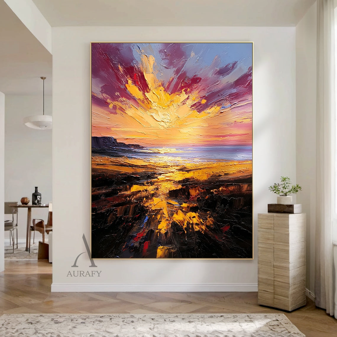 Impasto knife stroke coastal sunset landscape oil painting AURA747, full panoramic view: foreground dark brown rocky intertidal shore with golden sun-reflecting puddles dotted with subtle red tones, middle calm gray-blue coastal sea reflecting warm sunlight, background radiant golden sunburst with rich crimson red clouds, dark cliff silhouette on the left, thick textured impasto surface with bold expressive strokes, core color palette of brown and red.