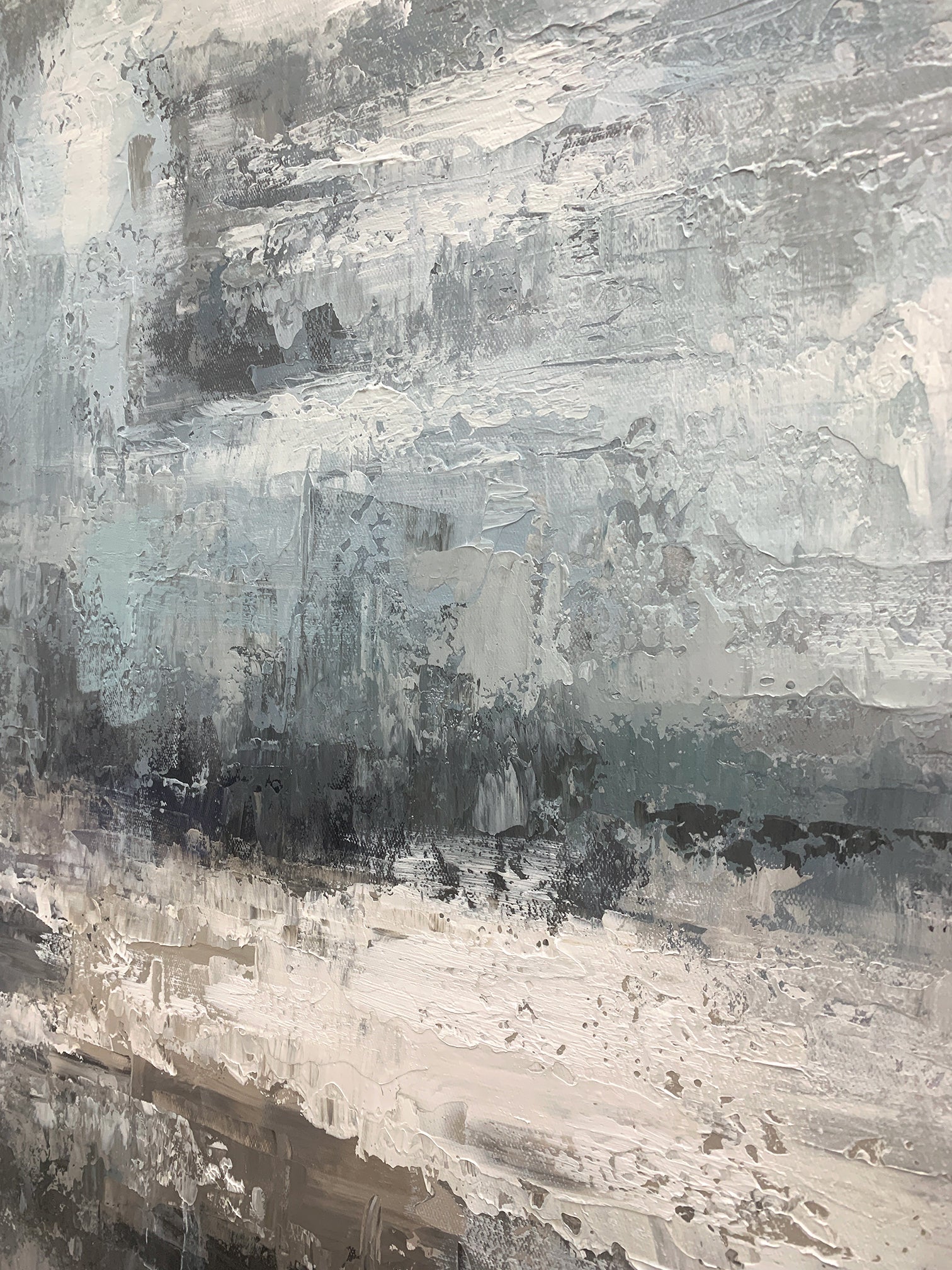Modern abstract blue geometric wall art with textured brushwork: shades of gray-blue, cobalt, white, gray, black, and subtle warm orange accents. Features abstract blocks and thick impasto texture. Displayed above a light gray linen sofa in a modern living room with a wooden coffee table and potted greenery—perfect focal point for minimalist, Nordic, or modern home decor. Ready-to-hang with a sleek black aluminum frame and premium waterproof canvas.