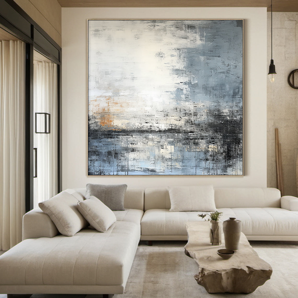 Modern abstract blue geometric wall art with textured brushwork: shades of gray-blue, cobalt, white, gray, black, and subtle warm orange accents. Features abstract blocks and thick impasto texture. Displayed above a beige fabric bed in a Nordic-style bedroom—perfect focal point for minimalist, Nordic, or modern home decor. Ready-to-hang with a sleek black aluminum frame and premium waterproof canvas.
