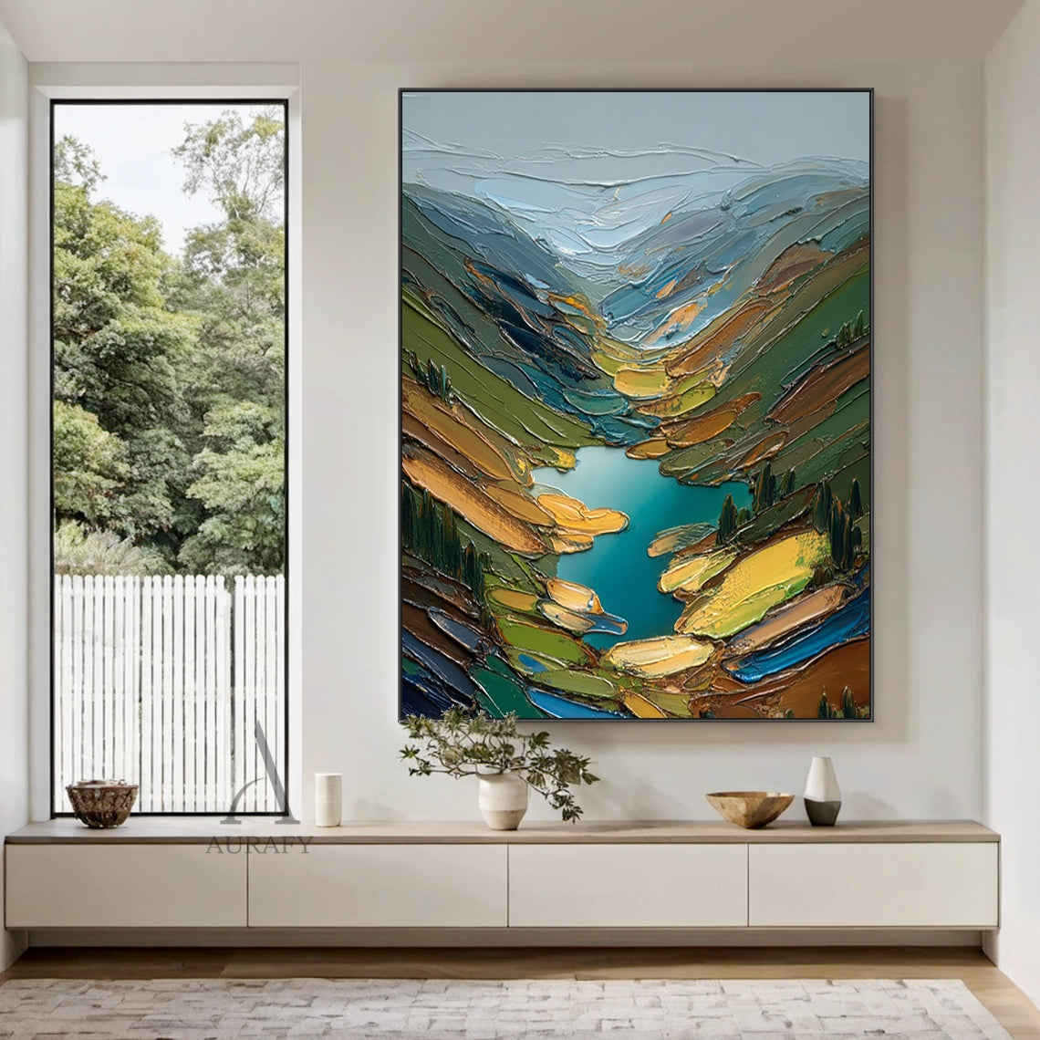 Green impasto semi-abstract landscape oil painting handcrafted with palette knife thick strokes, depicting layered mountain valley scenery: hazy misty snow-covered distant mountains in light blue and gray at the top, vibrant teal alpine lake as the core visual focal point in the center, sloped sides with multi-toned green coniferous forests, meadows, bare rock soil and warm sunlit grass patches. Thick pigment stacking creates rich tactile textured surface, balanced cold and warm color palette delivers natur