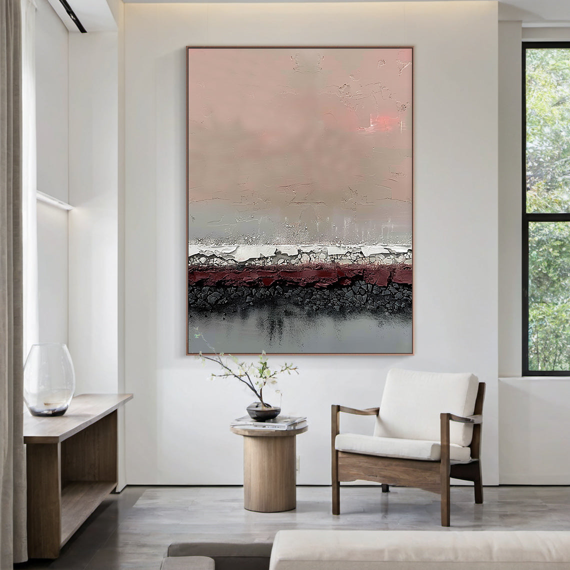 Vertical abstract art painting with layered textures: soft blush pink upper section, muted taupe gradient, textured white-silver crackle band, deep burgundy red layer, charcoal black crackle base, and cool gray bottom. Framed in warm metallic border, displayed on a warm oak wood accent wall in a cozy modern living room paired with a neutral linen sofa and sleek marble coffee table—ideal statement decor for contemporary living areas, home offices, or dining room focal points. This piece blends earthy tones w