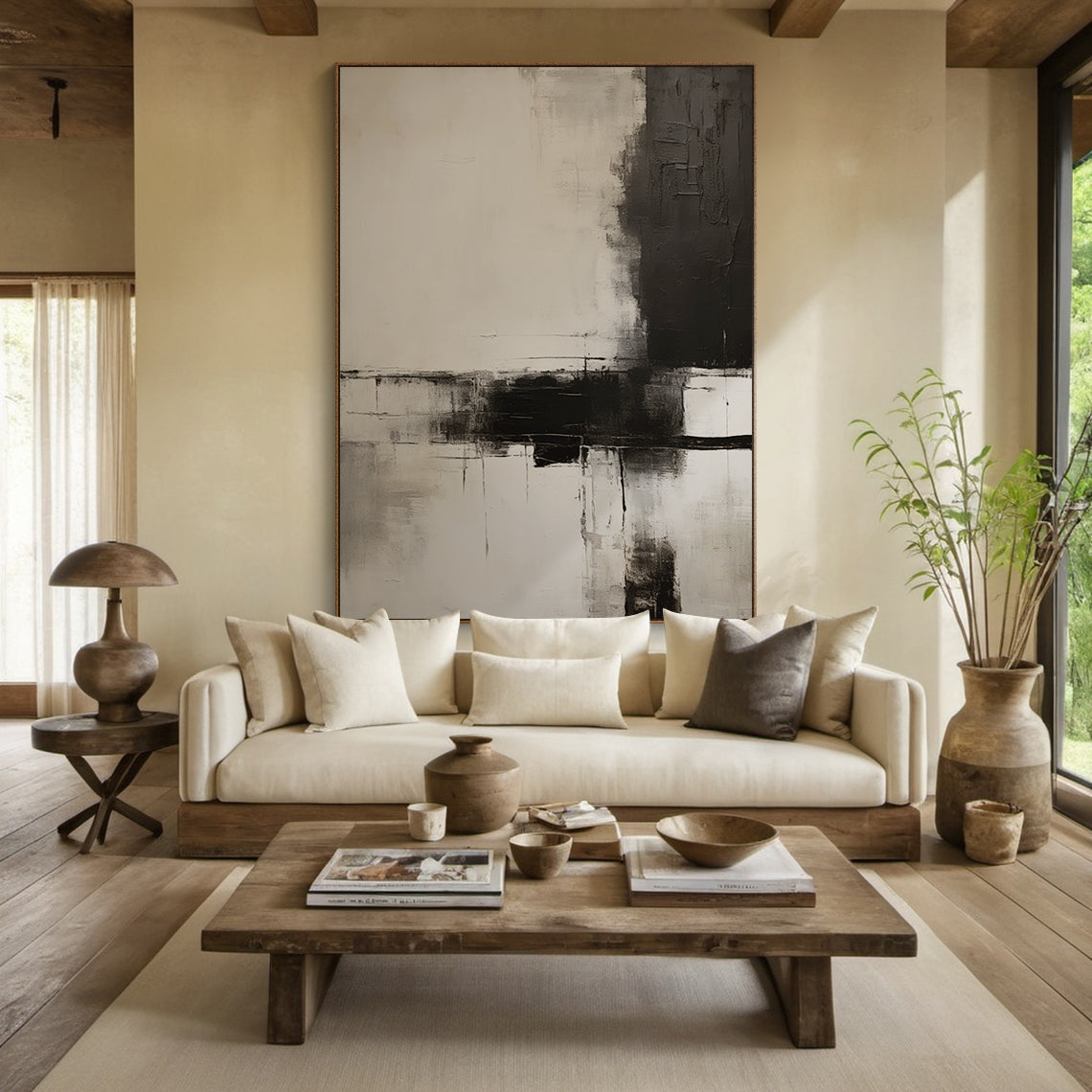 Vertical Minimalist Black White Gray Abstract Canvas Wall Art (Premium Cotton Canvas, Solid Wood Frame) | Focal Point Above Light Brown Leather Sofa in Sleek Modern Living Room. Bold dark blocks, layered brushstrokes, spacious negative space. Bathed in warm glow from a minimalist floor lamp, complements contemporary decor (light brown leather sofa, marble coffee table, potted snake plant, geometric throw pillows). Ideal for living room, bedroom, office—adds modern sophistication and cozy vibe. Suitable for