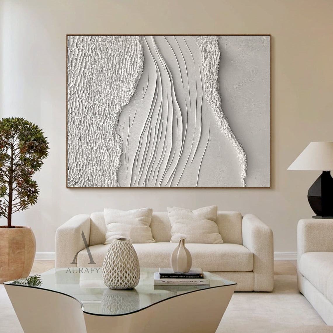 White Sea Textured High-Relief Plaster Artwork (AURA443): Abstract ocean-inspired piece with rough foam/sand-like textured edges, smooth flowing wave lines, monochromatic ivory-off white palette. Tactile 3D surface ideal for serene bedroom headboard walls, minimalist entryway accents, cozy reading nook centerpieces, or bright sunlit kitchen backsplash areas. Complements neutral decor and natural light.