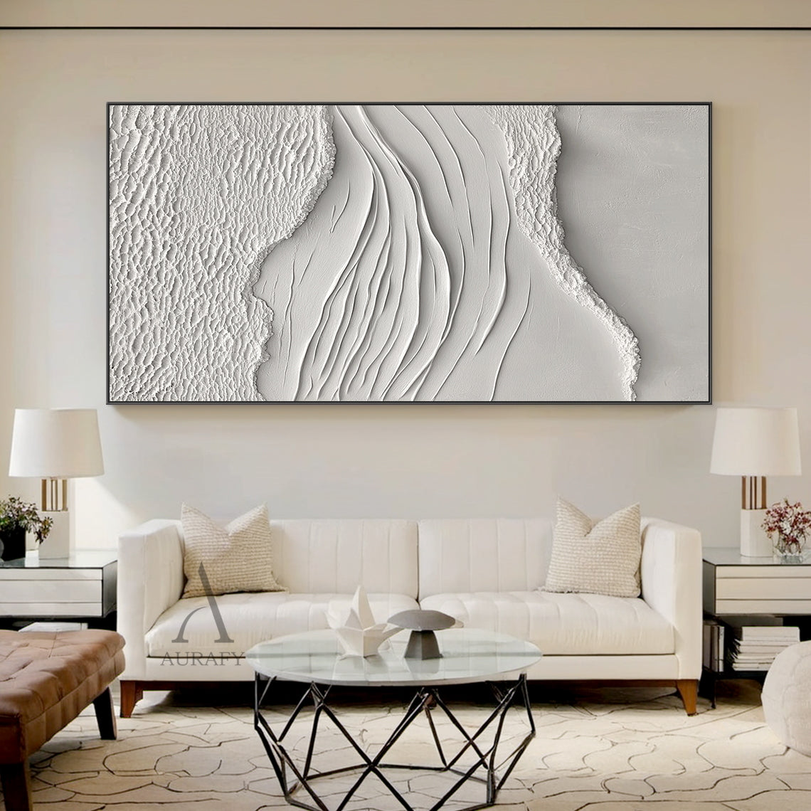 White Sea Textured High-Relief Plaster Artwork (AURA443): Abstract ocean-inspired piece with rough foam/sand-like textured edges, smooth flowing wave lines, monochromatic ivory-off white palette. Tactile 3D surface ideal for elegant living room sofa backdrop walls, sleek hallway end accents, tranquil study desk above decor, or airy sunlit terrace feature walls. Complements warm wood decor and soft ambient light.