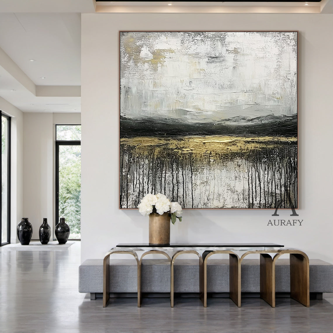 Minimalist Modern General Abstract Wall Art AURA253 - 3D impasto texture with vertical drips, soft white base transitioning to warm off-whites, deep black horizontal bands & shimmering gold stripe. Ideal for Japandi bedroom decor, minimalist sleep space focal point, or above a low-profile wooden bed. Neutral palette complements linen bedding & rattan accents, adding serene sophistication to cozy luxury interiors. Hung in portrait orientation in a tranquil Japandi bedroom, highlighting tactile depth and unde