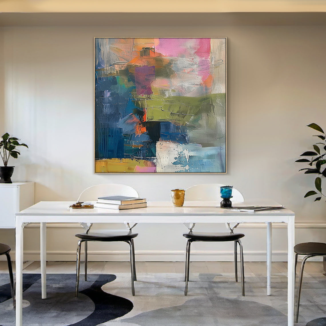 Large contemporary abstract canvas wall art with thick textured brushstrokes—dominant deep blue paired with pink, olive green, mustard yellow, white, and orange. Displayed as a striking focal point in a modern living room/entryway, this statement piece complements minimalist, eclectic, or modern interiors. Ideal for urban homes and apartments, adding dynamic visual depth and artistic flair to living spaces, entryways, or offices. Ready-to-hang with pre-installed hardware, it transforms any area into a vibra