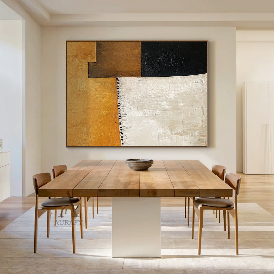 AURA641 Abstract Brown Beige Wall Art, modern organic abstract impasto painting with thick tactile brush strokes, presented hung in a real Japandi minimalist home scene above a light oak low cabinet. It features the signature large warm amber brown top block, vertical soft beige left block, dark brown and deep black geometric blocks on the right, with delicate black tassel-style short brush strokes as detailing between the brown and beige areas. All color blocks have clear visible hand-painted brush texture