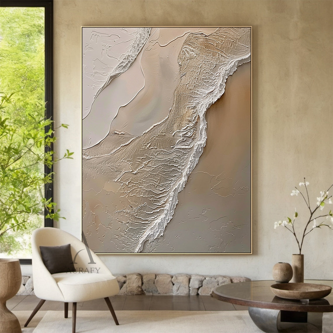 Ocean Brown Abstract Impasto Art: Tactile sculpted canvas with thick raised impasto layers of warm browns (light beige, sand tones) and wispy white lines mimicking ocean waves lapping at sunlit sand. High-relief texture creates dynamic shadows under soft ambient light. Perfect focal point for a cozy Nordic-style bedroom—above a light wood platform bed draped in cream linen bedding, flanked by woven rattan nightstands holding ceramic vases with dried pampas grass, complementing knit throw pillows and a macra