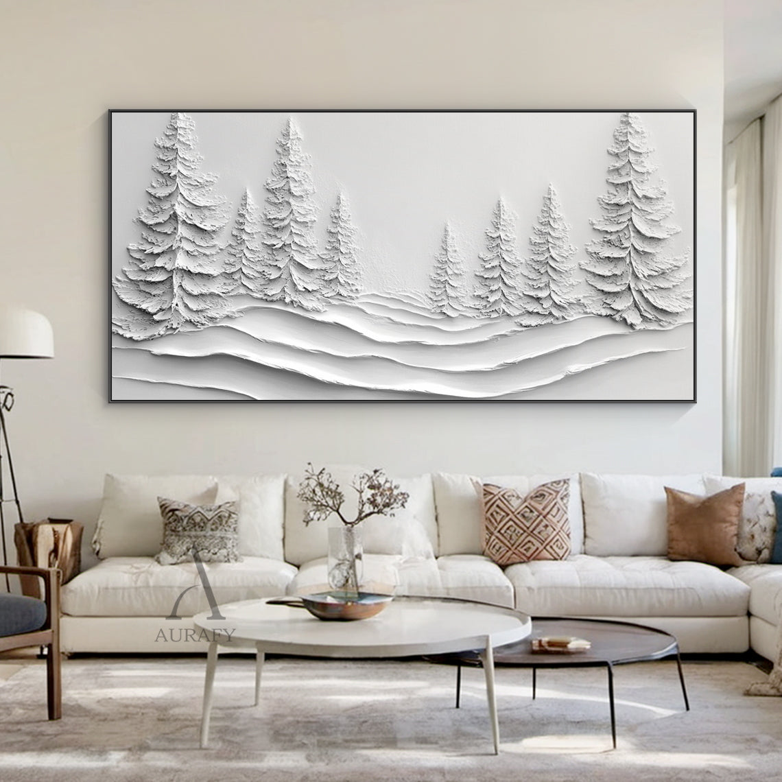 White Landscape Art (AURA457) – Minimalist modern high-relief layered 3D textured artwork featuring sculpted evergreen pine trees and undulating snowdrifts. Monochromatic white palette with subtle tonal shifts evokes serene calm, ideal for a cozy reading nook beside a linen armchair or above a small oak side table. Tactile surface creates dynamic light/shadow play, adding depth to intimate spaces. Blends wabi-sabi simplicity with winter landscape charm, complementing neutral tones and natural materials like