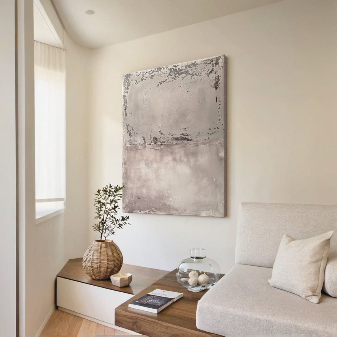 Wabi Sabi Abstract Tactile Impasto Gray Wall Art with Muted Pink Undertones & Distressed Surface (AURA191) - A warm focal point in a cozy bohemian bedroom. Features layered impasto texture, weathered patterns, soft silvery grays to deep charcoal, subtle pink hints. Displayed above a warm wooden bed frame with beige linen bedding, complementing woven macramé wall hangings, a potted fiddle leaf fig in the corner, and soft ambient light from a ceramic table lamp. Ideal for bohemian, organic home decor.