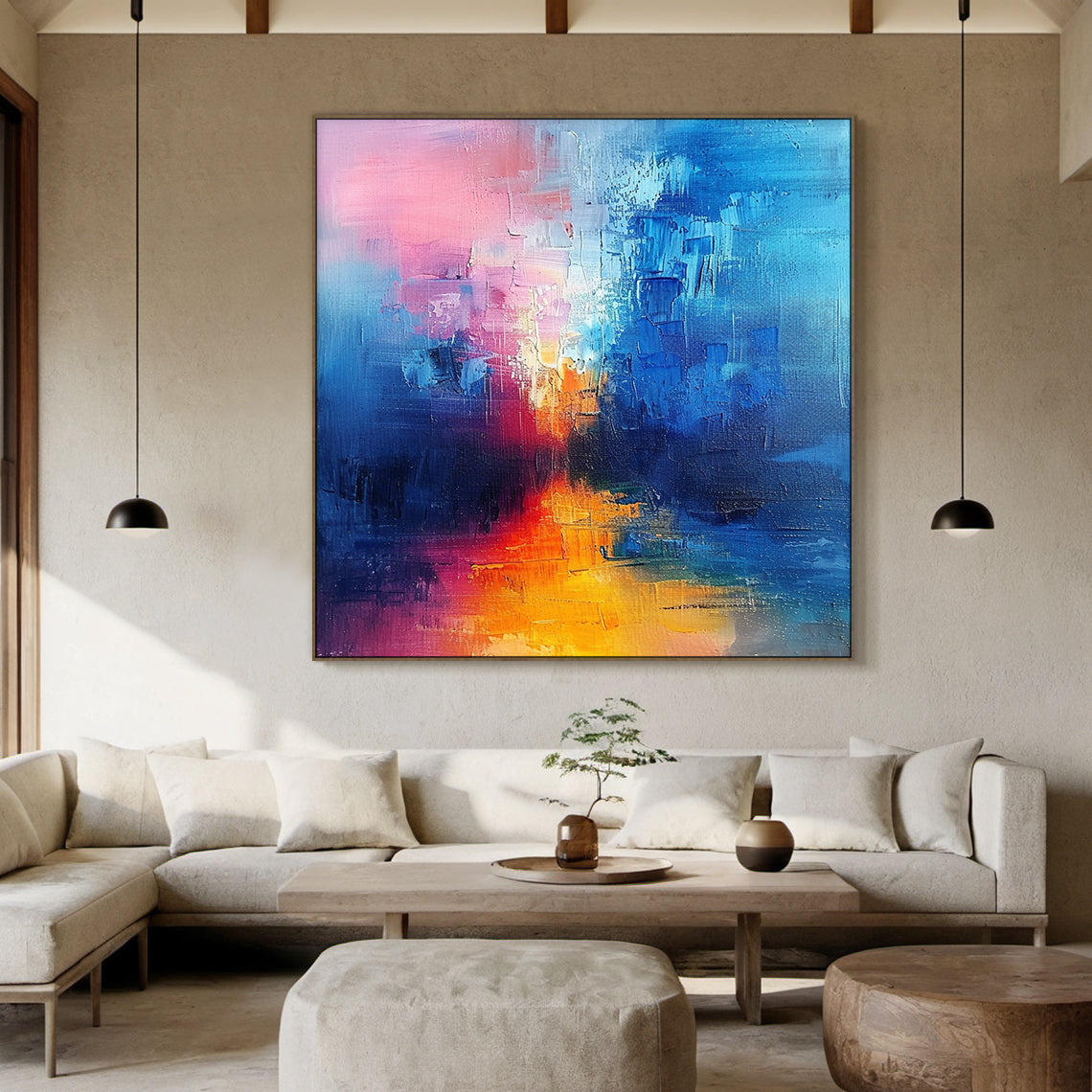 Wabi Sabi abstract oil painting with thick impasto texture—soft pink (upper right & middle accents), deep blue (left side & bottom corner), warm orange-yellow (center focal point). Handcrafted rough brushstrokes, natural color blending, ideal for modern living room wall decor, bedroom abstract art, or minimalist home interior. Hanging in a sunlit corner with a woven rug and potted fiddle-leaf fig, adding a warm and tranquil vibe to the space.
