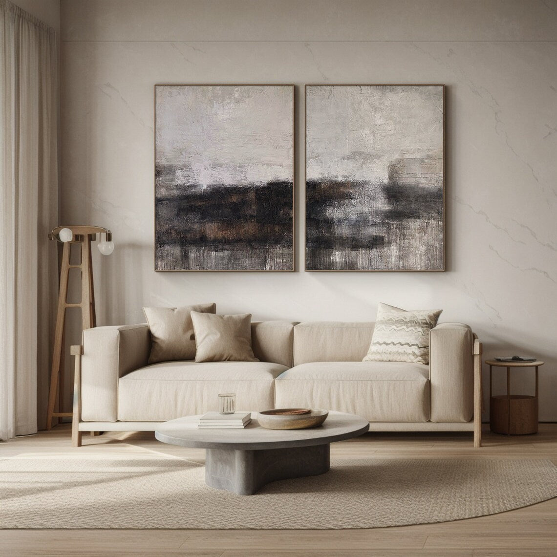 Two-piece Wabi Sabi abstract art set leaning against a light oak bookshelf in a cozy minimalist bedroom. Each canvas features tactile knife strokes, warm neutral tones (soft beige, deep charcoal, earthy brown) with subtle pink undertones, and intentional imperfect textures. The space includes a plush cream rug, a wooden side table with a small potted succulent, and soft linen bedding—ideal for creating a cozy, calm retreat with natural-inspired charm.