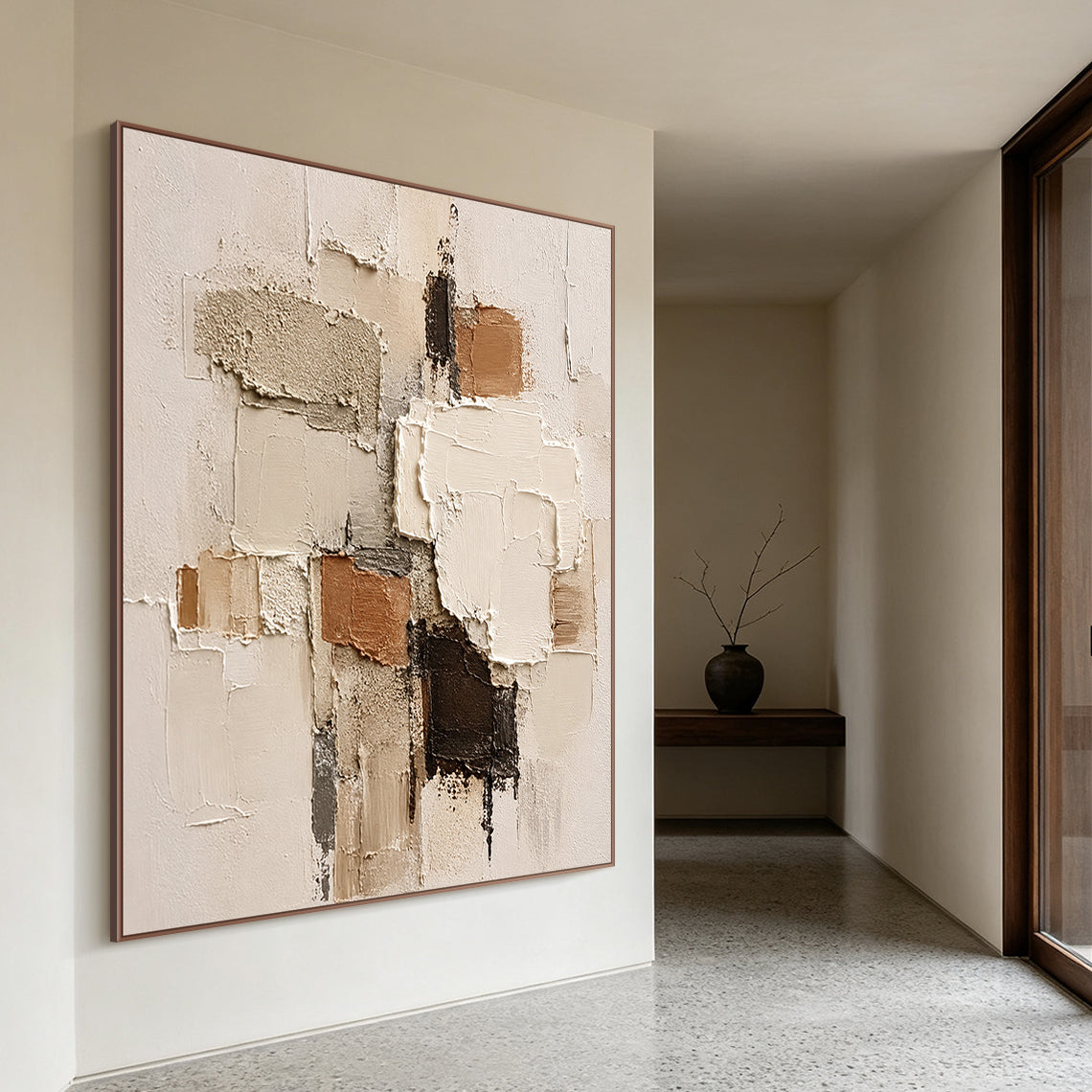 Wabi-sabi Japandi minimalist 3D textured abstract painting displayed on the soft off-white accent wall of a light oak Japandi living room, handcrafted with thick impasto techniques, features irregular geometric paint blocks in soft muted earth tones: warm beige, creamy off-white, rustic terracotta brown, deep chocolate brown, and understated cool gray. The artwork boasts mixed tactile textures of rough granular gritty patches, smooth raised palette knife strokes, and natural uneven cracked paint edges, brin