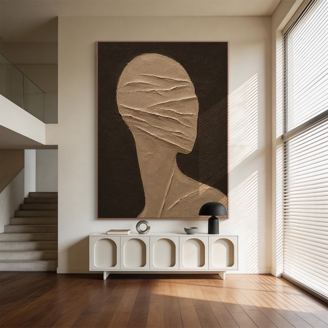 Wabi-Sabi brown 3D textured plaster abstract figure wall art AURA705, displayed in cozy neutral-toned bedroom nook paired with linen upholstery and raw oak furniture, dark deep brown matte textured background, warm taupe stylized faceless head and shoulder side silhouette, raised diagonal impasto ridges wrapping across the face area like bandages, hand-applied thick high-relief tactile texture, fits perfectly for wabi-sabi, japandi and earthy minimalist home space embellishment.