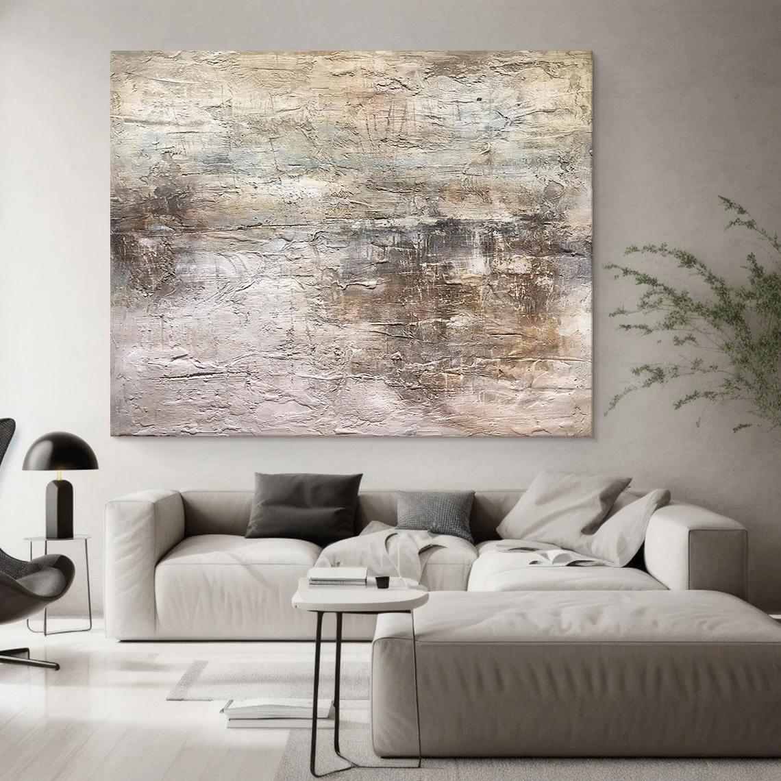 Wabi Sabi Abstract Art AURA217 - Hand-painted high-relief plaster wall decor with soft muted pink and warm neutral tones (beige, taupe, light gray). Hung on a light gray wall beside a wooden dining table in a minimalist dining area, highlighting its tactile uneven texture with thick brushstrokes and intentional imperfections. Ideal for Japandi living rooms, entryways, or modern organic spaces, complements gray walls, wood accents, and smooth surfaces.