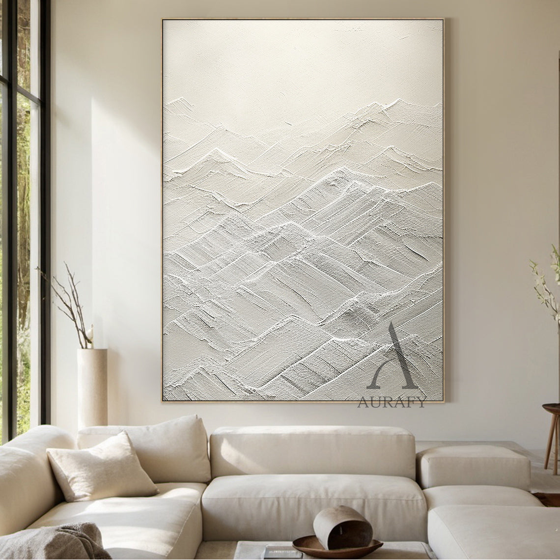 High-relief white abstract canvas art (AURA500) with thick tactile knife strokes and layered texture forming gentle peaks and valleys (evoking rolling mountains or serene waves). Monochromatic palette spanning soft ivory to crisp snow tones, merging modern minimalist style with subtle Wabi-sabi influences. Ideal focal point for Japandi spaces—perfect above a low wooden bed in a tranquil bedroom, next to a potted fiddle-leaf fig in a modern office, or against a warm oatmeal-colored wall in a cozy living room