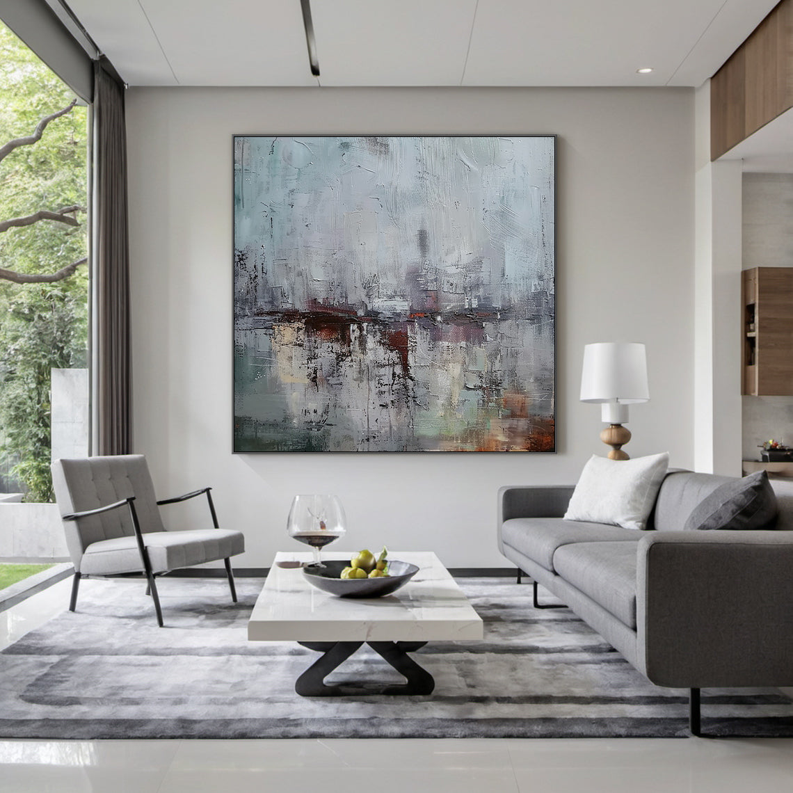 AURA229 Gray Blue Wabi Sabi Abstract Wall Art: Large Textured Canvas with Soft Gray-Blue Tones & Earthy Accents. Hanging Above Modern Gray Sofa in Bright Living Room, Complementing Neutral Cozy Space Decor. Wabi Sabi Style Embraces Imperfection & Natural Beauty—Ideal for Living Room Wall Decor, Cozy Reading Nooks, or Bedroom Spaces. This Art Piece Adds Understated Charm to Serene Living Areas, Merging Minimalist Elegance with Rustic Warmth as Part of the AURA229 Wabi Sabi Home Decor Collection. Perfect for 