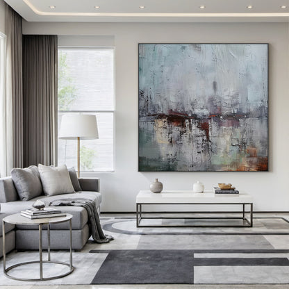 AURA229 Gray Blue Wabi Sabi Abstract Wall Art: Large Textured Canvas with Soft Gray-Blue Tones & Earthy Accents. Hanging Above Minimalist Wooden Bed in Serene Bedroom, Complementing Warm Neutral Bedding & Cozy Ambient Lighting. Wabi Sabi Style Embraces Imperfection & Natural Beauty—Ideal for Bedroom Wall Decor, Cozy Reading Nooks, or Living Room Spaces. This Art Piece Adds Understated Charm to Calm Bedroom Areas, Merging Minimalist Elegance with Rustic Warmth as Part of the AURA229 Wabi Sabi Home Decor Coll