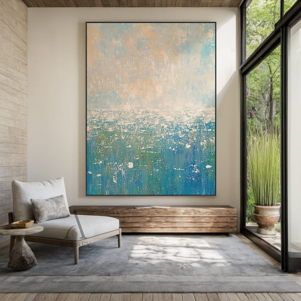 Abstract Beige Blue Impasto Artwork AURA405 Japandi Open-plan Dining Space Installation Display, the piece is mounted on a soft warm milk coffee accent wall above a light oak extendable dining table, its soft upper gradients of pale blue and muted beige blend perfectly with the surrounding light linen dining chairs and natural wood tableware decor, the lower layered blue tones ranging from bright sky blue to deep teal infuse the space with a relaxed fresh natural vibe, the thick textured impasto strokes sho