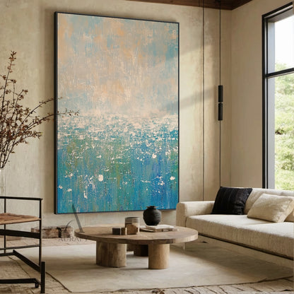 Abstract Beige Blue Impasto Artwork AURA405, upper part blends soft light blue and muted beige gradients with mottled, scratched textured strokes, lower section features layered shades of blue (from sky blue to deep teal) paired with irregular white splatter and smudge knife stroke details, entire canvas has thick tactile impasto texture with no figurative elements, abstract expressionist style that conveys serene, calm vibe, perfect for Japandi, minimalist and modern coastal interior decor.