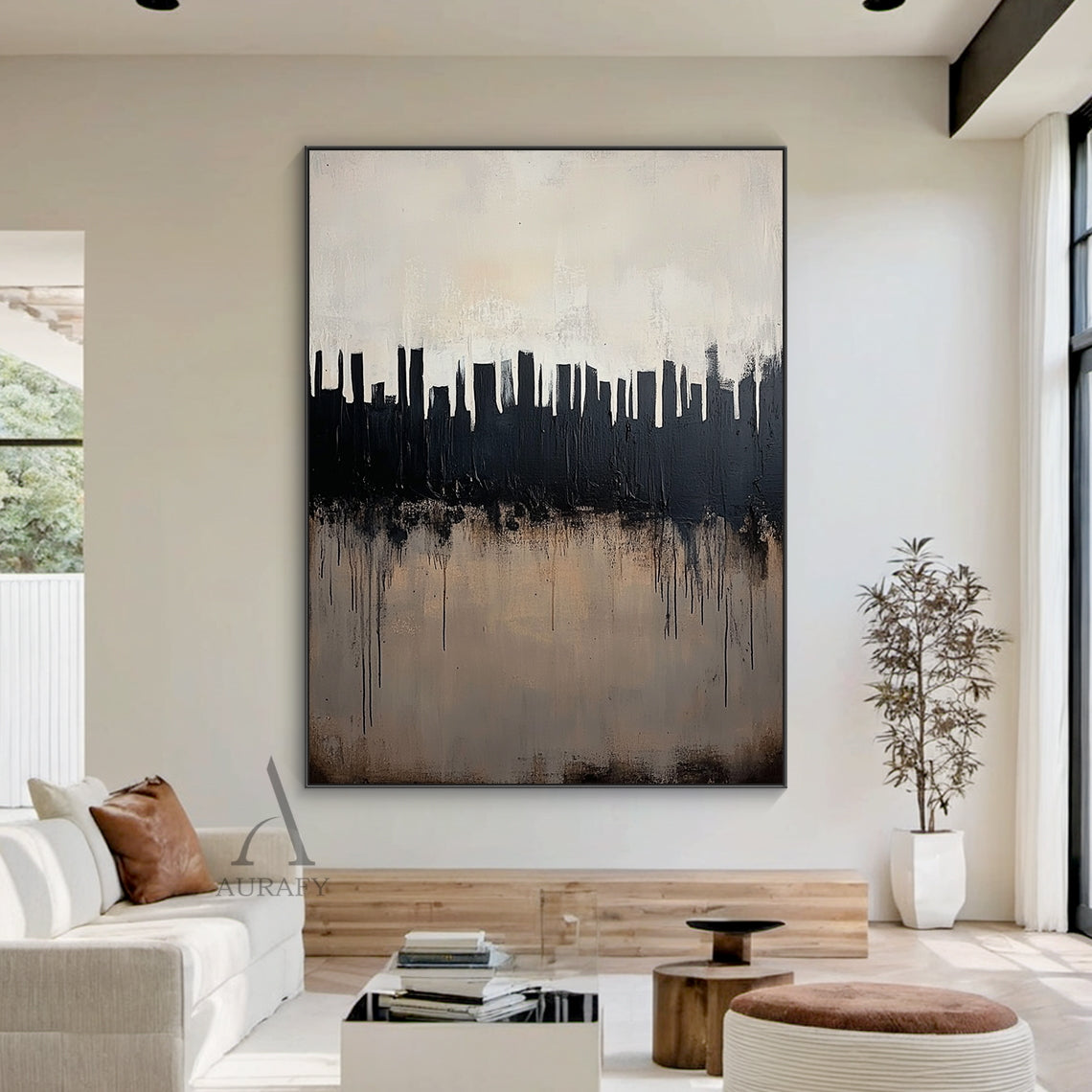 Abstract black and beige city skyline wall art styled in a soft neutral minimalist home interior scene, heavy impasto thick brushstrokes form bold black urban skyscraper silhouettes against a muted pale off-white gradient background, intentional black paint drips cascade over the textured warm beige lower area simulating city water reflection, tactile minimalist luxe abstract artwork hung on a light oat-colored wall to show its matching effect for modern Japandi and minimalist home decor.