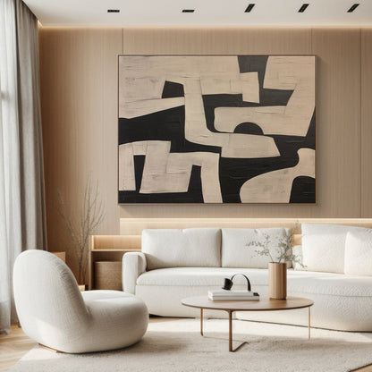 Black and off-white abstract geometric wall art (modern living room wall art) with thick textured brushstrokes and irregular blocks. Framed in wooden frame, displayed in a modern living room with soft neutral decor (beige sofa, wooden coffee table, warm floor lamp, natural light through sheer curtains). Ideal for modern, Scandinavian, or minimalist style spaces—living room focal point, cozy home office accent, or bedroom statement piece. Premium matte canvas art with dynamic balance and tactile depth, enhan