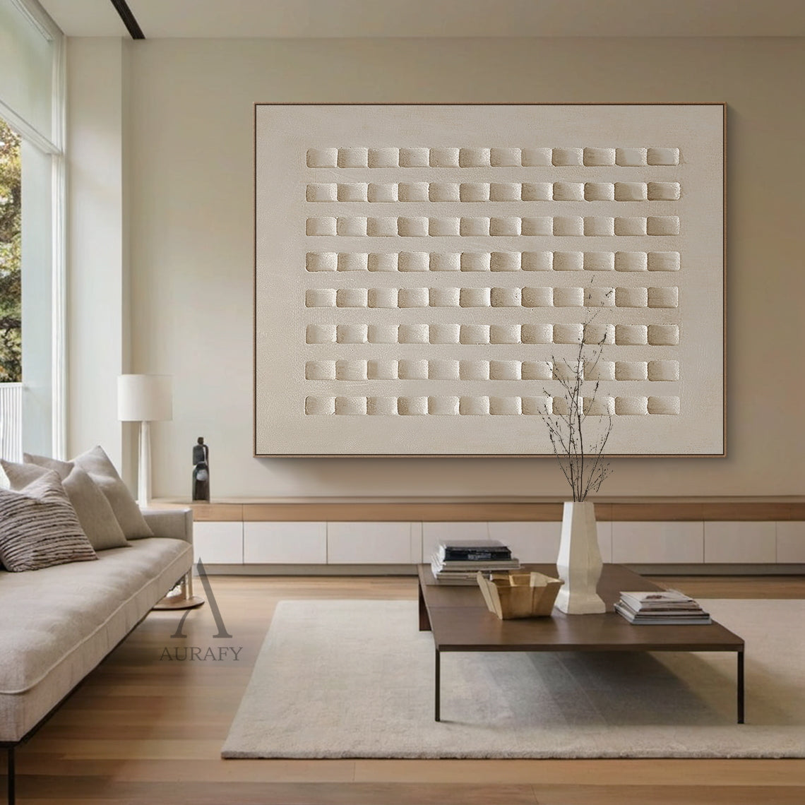 AurafyArt AURA633 abstract beige plaster wall art, monochromatic warm muted beige tone, features high-relief structured grid design with 8 neat vertical columns of recessed square blocks, has subtle cement-like textured plaster surface, hung on the light oak accent wall of a Japandi style living room, natural daylight casts soft layered shadows on its concave-convex textured details, modern minimalist wabi-sabi abstract decorative artwork perfect for adding understated texture to minimalist, Japandi and neu
