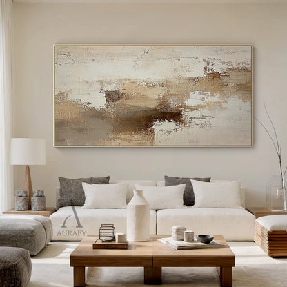 AURA634 abstract beige textured canvas wall art, features a neutral palette of soft beige, layered varying tan brown shades and warm off-white with gentle color transitions. The surface has clear handcrafted texture with visible thick impasto, scratch, and paint stacking brush strokes, blending uneven paint texture with canvas base texture. It has no specific figurative elements, composed of irregular abstract color blocks and loose texture patches, presenting a minimalist warm abstract style suitable for N
