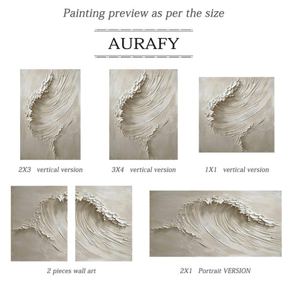 AURAFY beige monochrome high relief impasto canvas wall art hung in a neutral-toned home space, handcrafted with thick sculpted plaster/heavy acrylic texture to present a vivid rolling cresting sea wave. Multi-layered raised strokes form the soft flowing curve of the wave body, ragged uneven raised edges at the top simulate the foamy splashing of breaking surf, paired with a smooth matte warm beige background. The 3D textured surface produces natural varied light and shadow layers under indoor ambient light