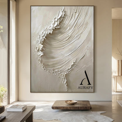 AURAFY beige monochrome high relief impasto canvas wall art, handcrafted with thick sculpted plaster/heavy acrylic texture to recreate a dynamic cresting sea wave. Layered raised strokes form the flowing curve of the wave body, frayed uneven raised edges at the top mimic splashing breaking surf, with a smooth matte warm beige background. The 3D textured surface creates natural light and shadow layers, perfectly fits wabi-sabi, Japandi, minimalist, coastal neutral interior decor styles.