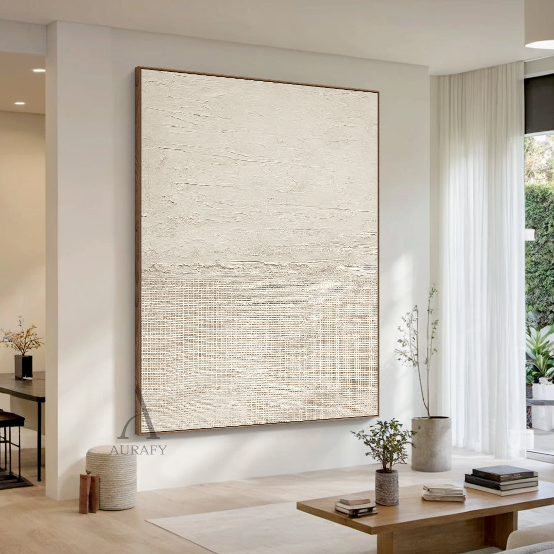 Beige general abstract wabi-sabi wall art hung in warm cream minimalist small apartment dining space scene, upper part features light creamy off-white thick impasto plaster-like rough horizontal textured finish with subtle organic imperfections, lower part comes with slightly deeper warm beige fine linen grid woven texture, connected by a raw uneven handcrafted torn-edge seam, monochromatic neutral tactile canvas artwork displayed against matte off-white latex wall beside light oak dining set as decor effec