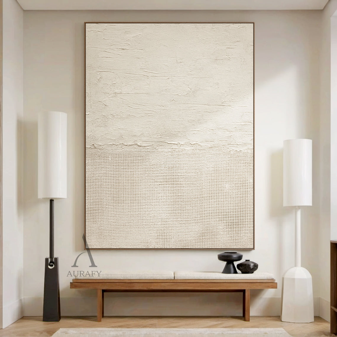 Beige general abstract wabi-sabi wall art hung in real Japandi minimalist home living space scene, upper part features light creamy off-white thick impasto plaster-like rough horizontal textured finish with subtle organic imperfections, lower part comes with slightly deeper warm beige fine linen grid woven texture, connected by a raw uneven handcrafted torn-edge seam, monochromatic neutral tactile canvas artwork displayed against light oak backdrop as decor effect reference, SKU AURA722