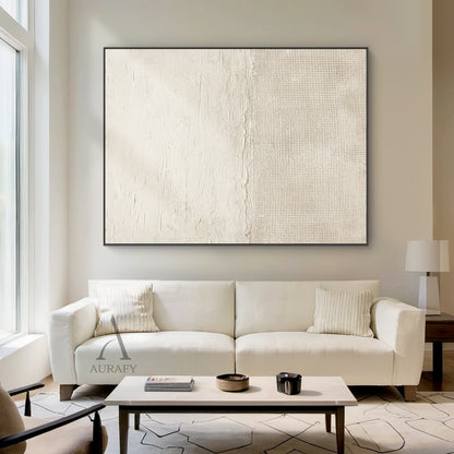 Beige general abstract wabi-sabi wall art, upper part features light creamy off-white thick impasto plaster-like rough horizontal textured finish with subtle organic imperfections, lower part comes with slightly deeper warm beige fine linen grid woven texture, connected by a raw uneven handcrafted torn-edge seam, monochromatic neutral tactile canvas artwork for Japandi minimalist home decor, SKU AURA722