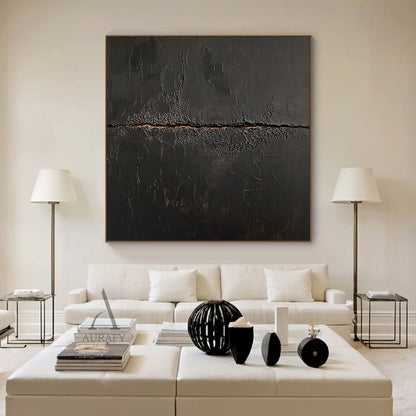 Black general abstract textured impasto canvas wall art AURA723, deep matte black surface with heavy crackle texture resembling aged cracked lacquer or charred earth, a rough horizontal split runs across the center of the piece with subtle warm earthy gold underlayer exposed, fine organic fissures spread out from the split, raw wabi-sabi tactile artwork for moody modern interior decor