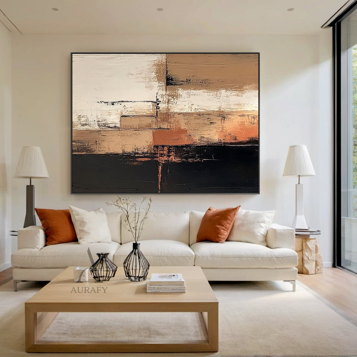 Abstract Brown Black Textured Canvas Art (AURA642) Real Scene Display, general abstract style artwork with layered irregular blocks of deep black, varying warm brown shades, soft off-white, subtle terracotta accents, divided by uneven dark lines. Thick impasto paint application, rough vertical brushstrokes, blurred feathered color transitions deliver a strong tactile, hand-painted textured visual effect, presented hung on a neutral plain wall to show the actual decor effect, perfectly suitable for modern ne