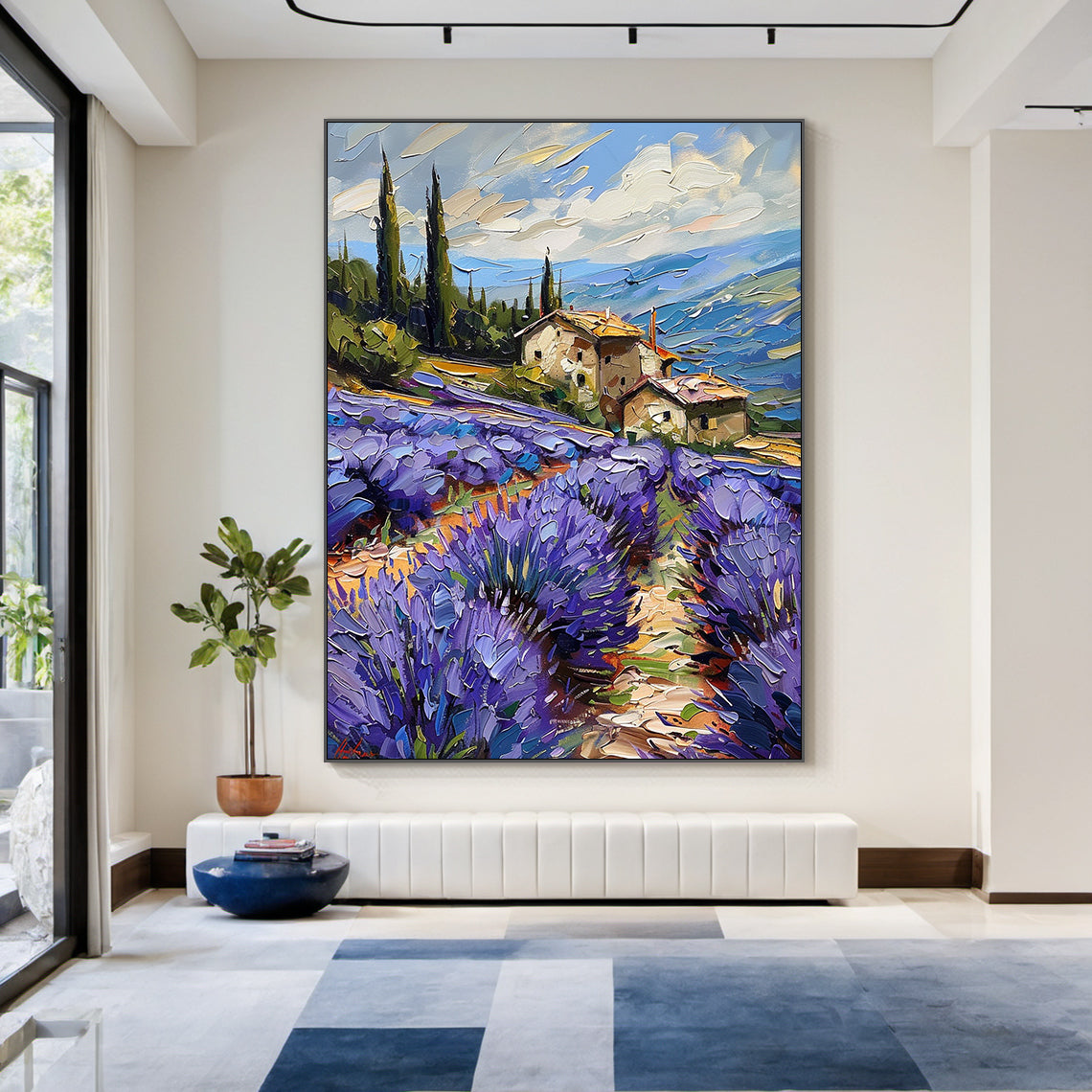 Impasto palette knife oil painting of vibrant Provence lavender landscape, foreground features thick textured deep violet and purple lavender flower clusters with warm terracotta winding country dirt path, midground includes rustic southern European stone farmhouses with warm orange roofs and tall dark green Mediterranean cypress trees, background shows layered blue rolling hills and light blue sky with creamy pale yellow-pink flowing clouds, 3D textured impressionist landscape wall art decor for residentia