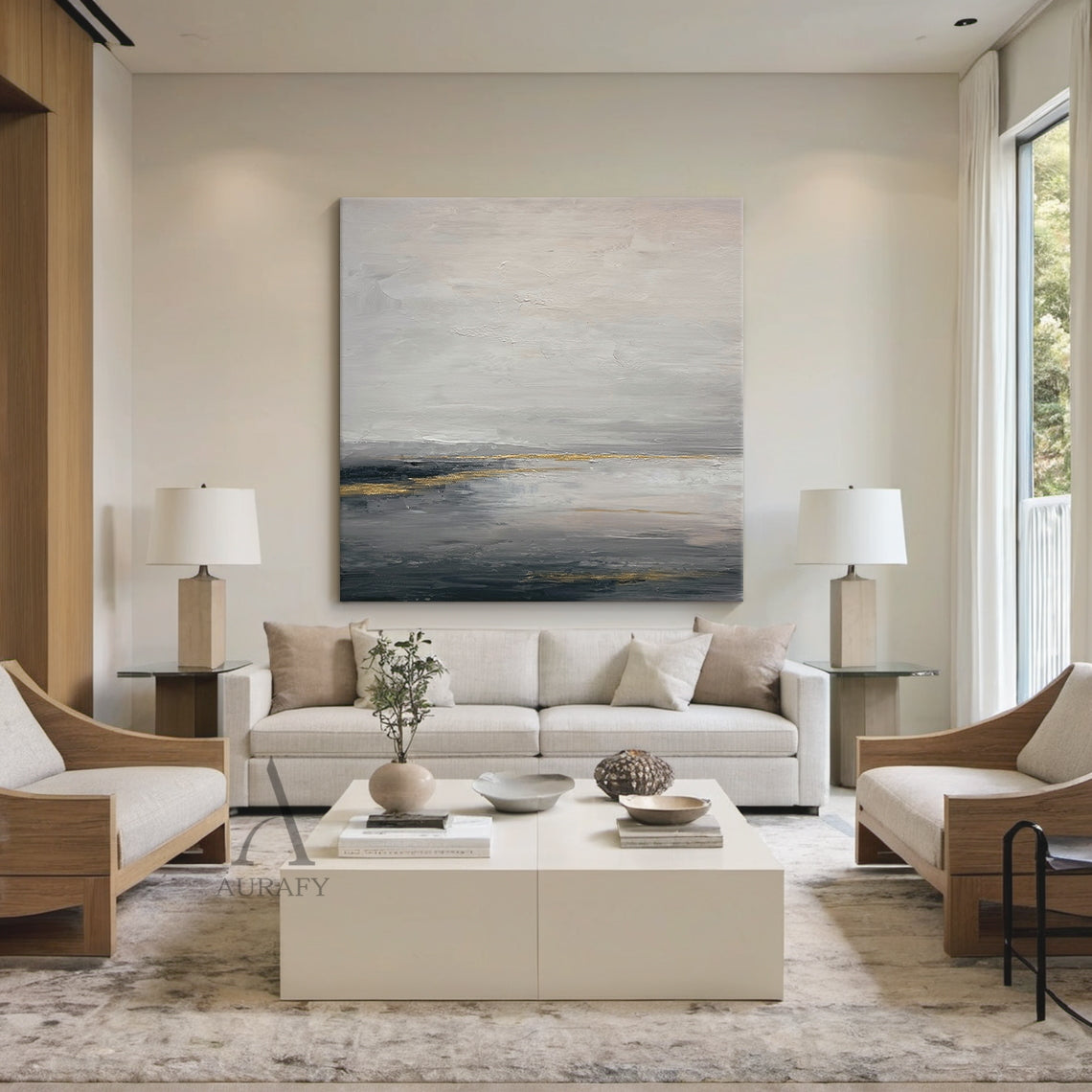 General Abstract gray beige canvas wall art (AURA626), features layered muted gray shades (light, medium, dark) as base with soft beige transition zones, accented with subtle shimmering golden streaks and patches. Tactile textured brush strokes build abstract layers: loose, hazy upper light gray and beige areas evoke misty cloud or fog imagery, thick deep gray lower layers mimic dark water or ground, golden elements simulate natural light reflection. Calm minimalist luxe abstract artwork for modern interior
