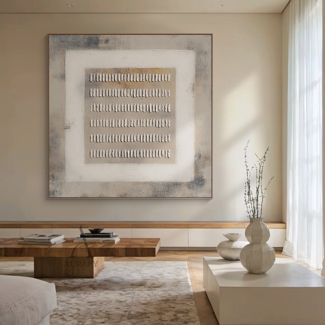 Gray General Abstract high-relief plaster wall artwork AURA627 (home installation scene display), features the consistent signature nested three-layer geometric structure: mottled textured dark gray outer background, light off-white square middle border, light brown-gray core base, installed on a plain soft white interior accent wall. 6 rows of handcrafted irregular raised white short strip plaster elements are neatly arranged on the core base, with obvious tactile thick coating relief texture. All neutral 