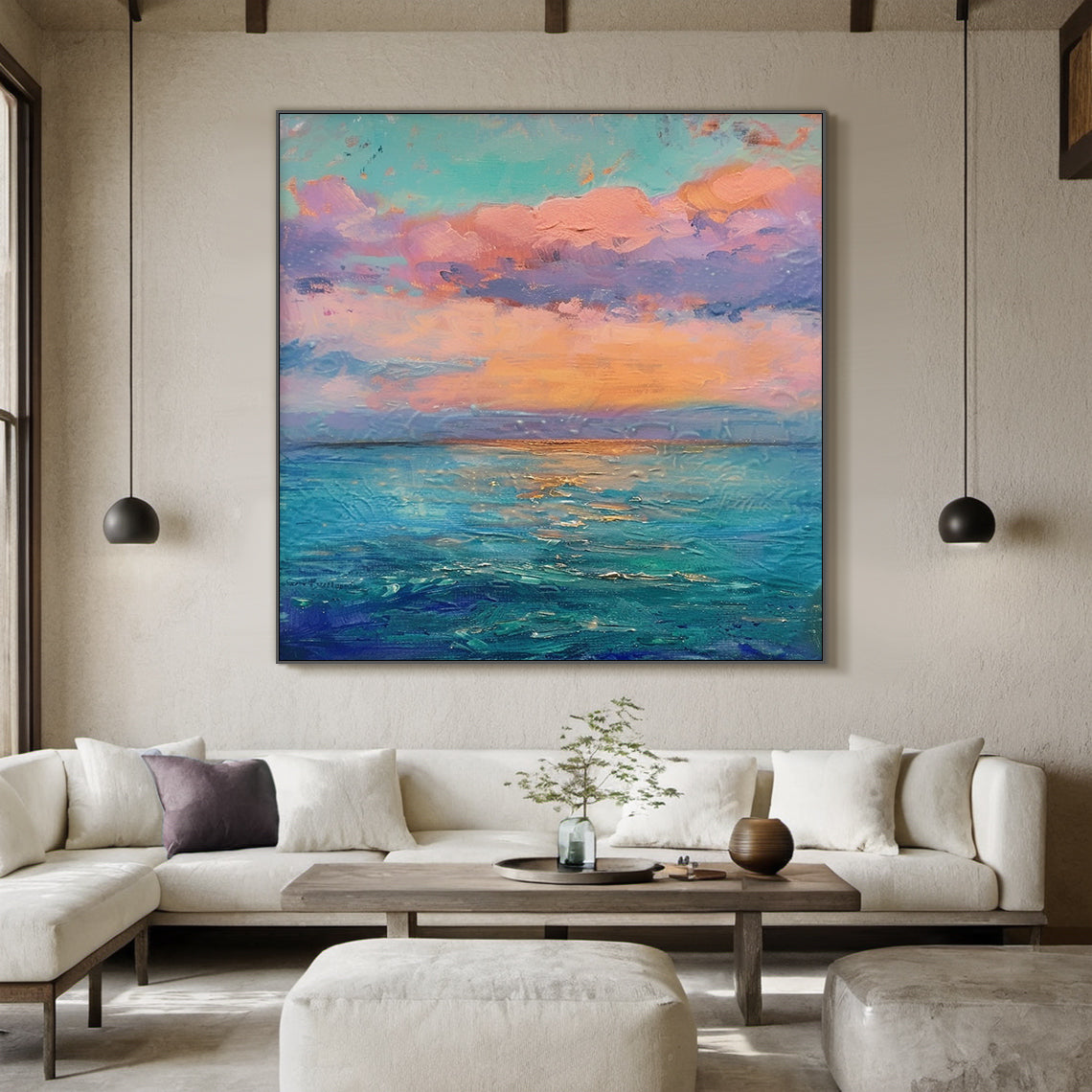 Impressionist thick impasto coastal sunset vertical canvas wall art, hanging display on light creamy wall above modern linen sofa, soft pink, peach, lavender gradient clouds under pale turquoise sky, warm orange sunset glow above layered indigo, teal, light blue ocean with golden light reflections, textured palette knife strokes, dreamy pink blue landscape painting for living room bedroom modern home decor AURA712