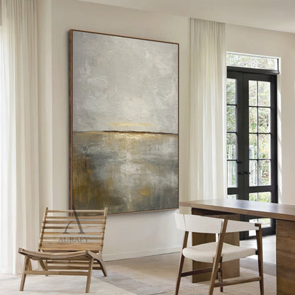 General abstract Japandi style palette knife impasto canvas wall art AURA625, with layered soft gray tones in upper section mimicking misty sky, warm beige and subtle golden ochre blended lower area evoking calm dawn shore, thin dark horizon line divides the neutral composition, thick raised textured strokes deliver rich tactile sense, ideal for modern Nordic minimalist interior decor.
