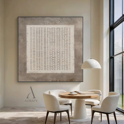 Abstract Gray Plaster Textured Wall Art AURA630: the artwork is hung on the warm off-white bedroom headboard wall next to a solid wood floating nightstand and a small dried flower arrangement, it adopts rough mottled gray plaster as the base, comes with a central white square with subtle hand-drawn uneven edges filled with orderly arranged repeating horizontal short line grid, gaps between lines reveal the gray base, the neutral monochrome gray and white minimalist abstract design is suitable for Japandi, m