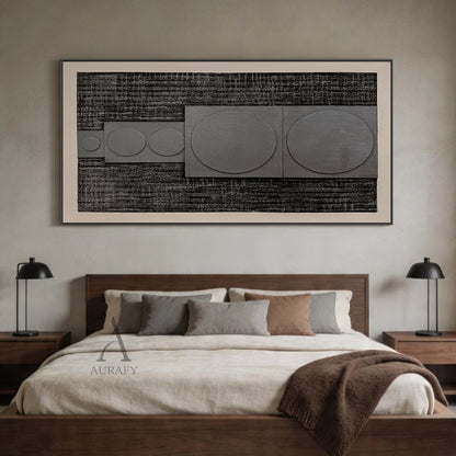 Horizontal monochrome black gray 3D textured geometric abstract canvas wall art real installation scene shot (AURA728), features rough dark near-black ridged woven-like background, slightly raised matte light gray rectangular panels with graduated circular forms growing in size from left to right, framed by soft light off-white blank border, minimalist Japandi wabi-sabi wall decor presented in actual warm log-style dining room space to show space matching effect