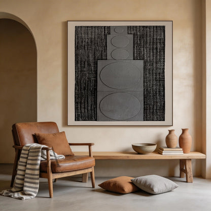 Horizontal monochrome black gray 3D textured geometric abstract canvas wall art real installation scene shot (AURA728), features rough dark near-black ridged woven-like background, slightly raised matte light gray rectangular panels with graduated circular forms growing in size from left to right, framed by soft light off-white blank border, minimalist Japandi wabi-sabi wall decor presented in actual home space to show space matching effect