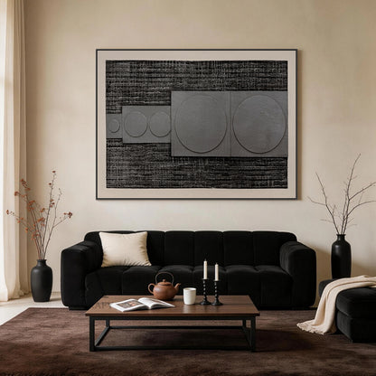 Horizontal monochrome black gray 3D textured geometric abstract canvas wall art real installation scene shot (AURA728), features rough dark near-black ridged woven-like background, slightly raised matte light gray rectangular panels with graduated circular forms growing in size from left to right, framed by soft light off-white blank border, minimalist Japandi wabi-sabi wall decor presented in actual home space to show space matching effect