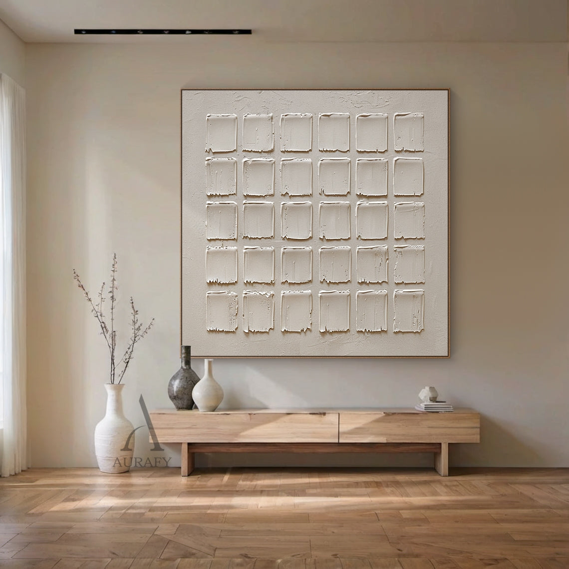 5x6 grid of handcrafted beige squares with rough, non-mechanical edges and tactile impasto texture—subtle brush strokes, dimensional surface variations, and wabi-sabi-inspired imperfection. Modern organic minimalist abstract art displayed in a cozy Scandinavian bedroom scene: set against a soft white plaster wall, beside a low-profile oak bed draped in cream linen bedding, next to a slim wooden nightstand with a small potted succulent and a woven wool throw, amplifying the tranquil, warm ambiance. Neutral b