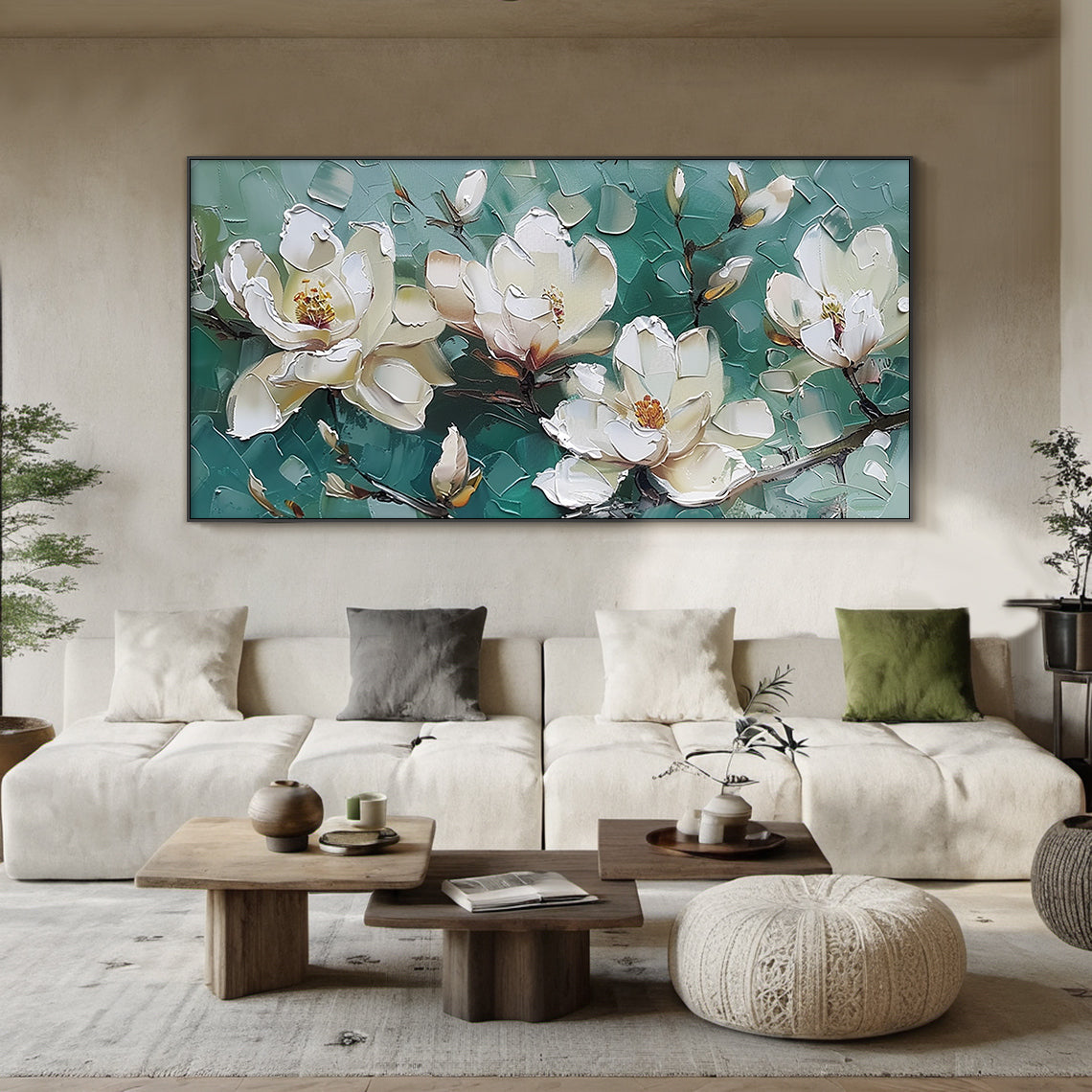 Horizontal textured palette knife magnolia oil painting, creamy white fully bloomed magnolias with warm yellow-orange stamens, plump half-open buds and slender dark branches against layered muted sage green blocky impasto background, modern Japandi wabi-sabi green white floral wall art hung above off-white linen sofa in light oak living room for warm minimalist neutral home decor artwork.