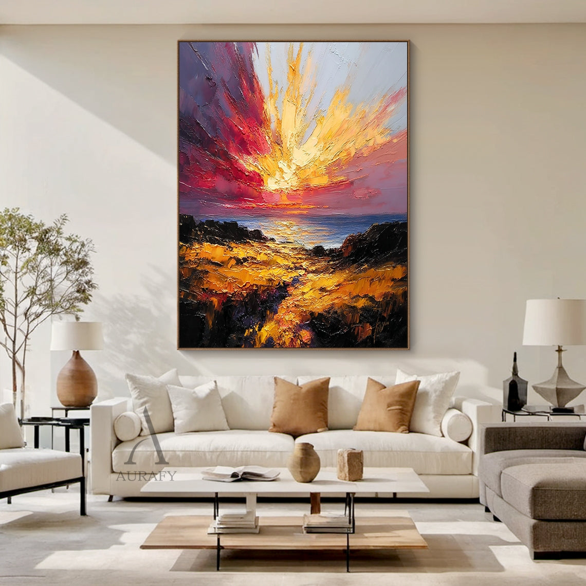 Textured palette knife impasto coastal sunset landscape painting, vivid radiating golden sunburst blends with deep burgundy, fiery red and dusky pink clouds in the sky, cool blue sea below reflects warm sunlight, foreground is warm brown and gilded sunlit rocky shoreline, thick raised heavy impasto brushstrokes create rich tactile texture, bold warm tone dramatic coastal nature wall art for modern home decor.
