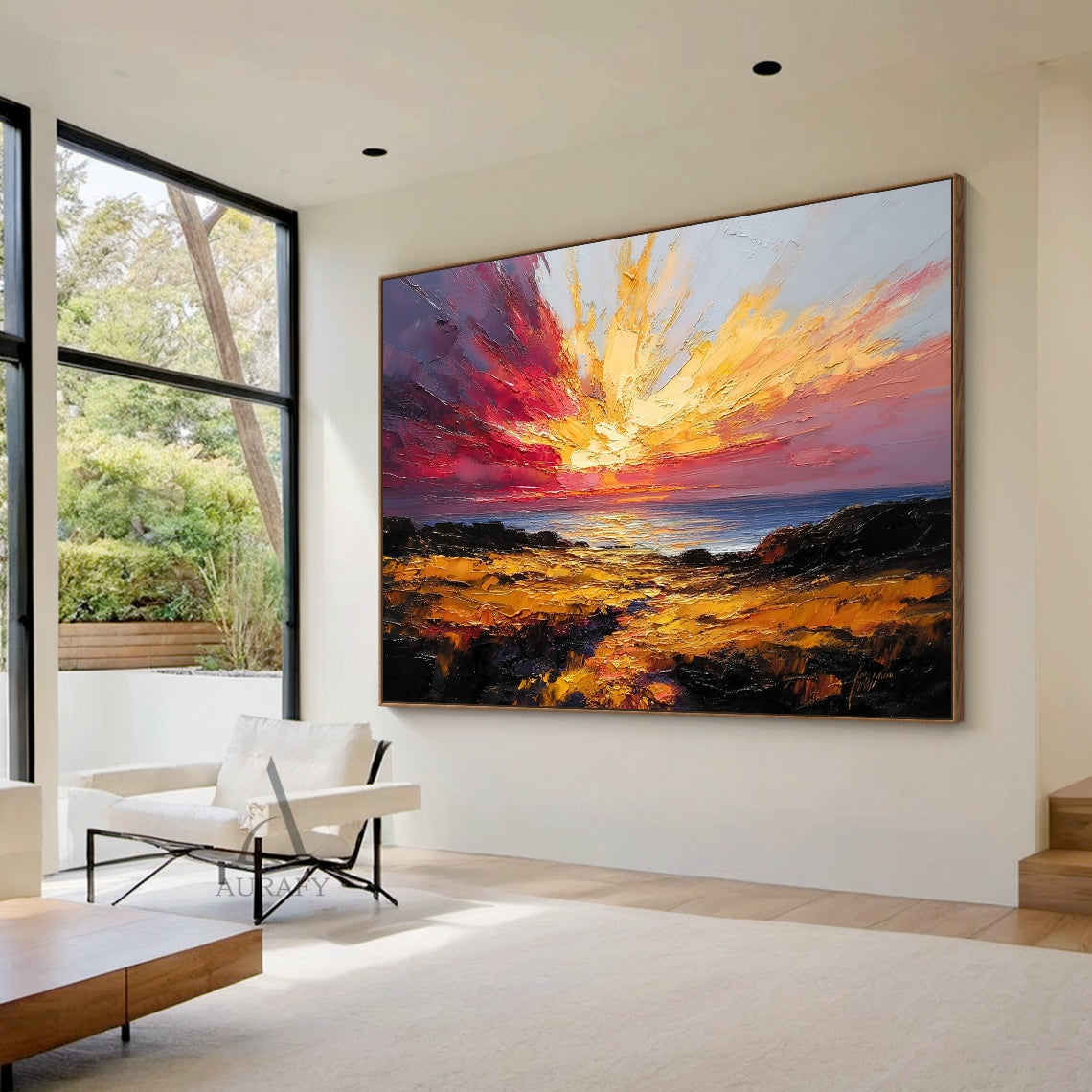 Textured palette knife impasto coastal sunset seascape painting, hung as the focal decor on the light gray accent wall of a contemporary minimalist living room above a cream linen sofa, its warm golden sun, burnt orange cloud and deep indigo sea tones harmonize beautifully with the neutral wood and soft fabric furnishings, the thick raised sculptural impasto brushstrokes are clearly visible even from a distance bringing rich tactile layering, this stunning warm-toned coastal nature wall art is a perfect pic